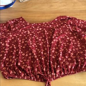 Red blouse with pink flowers and a strappy back